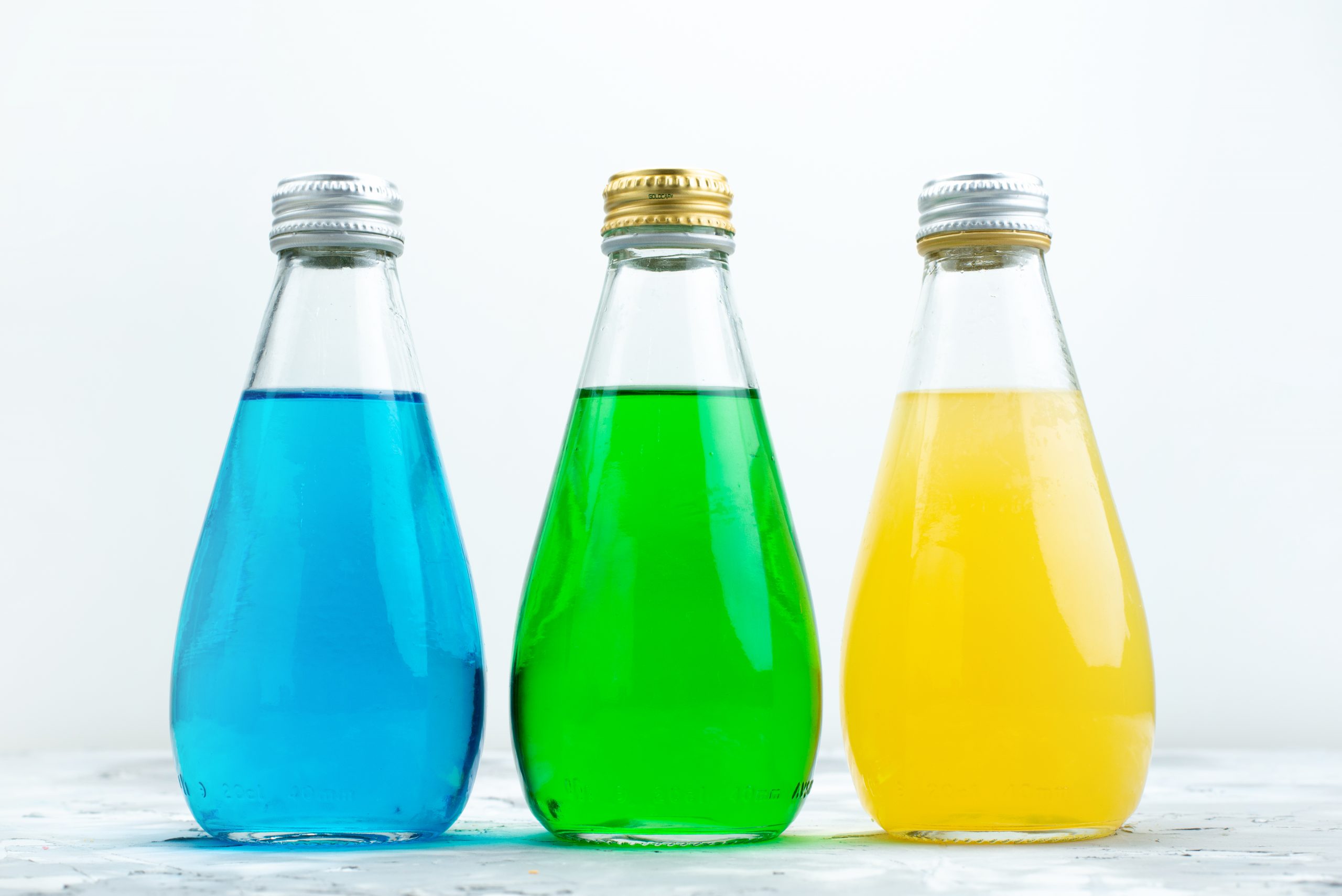 https://www.ajantabottle.com/blog/wp-content/uploads/2023/02/front-view-colorful-juices-inside-glass-bottles-white-drink-juice-color-scaled.jpg